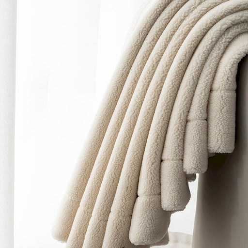 a stack of white towels sitting on top of a white shelf