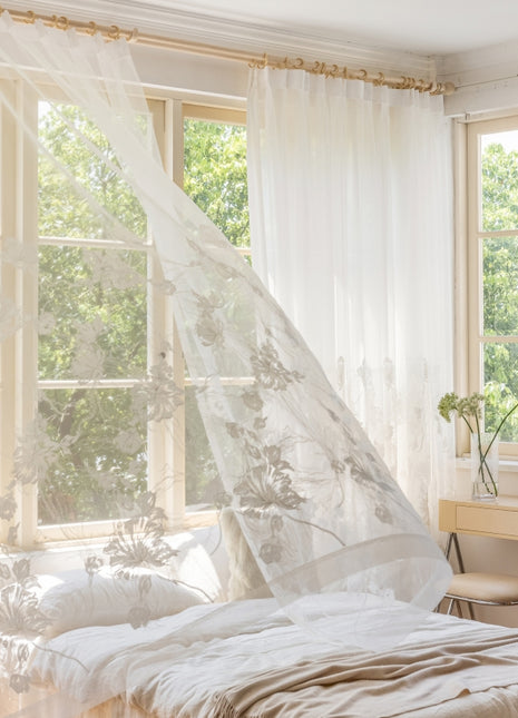 a bed with a white canopy in a bedroom