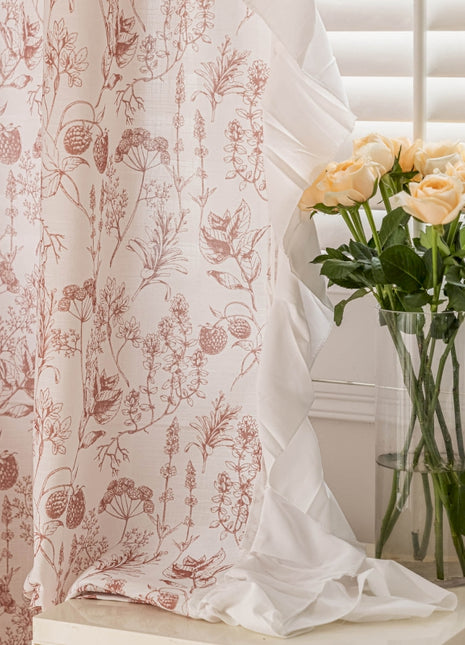 a vase filled with yellow roses next to a window