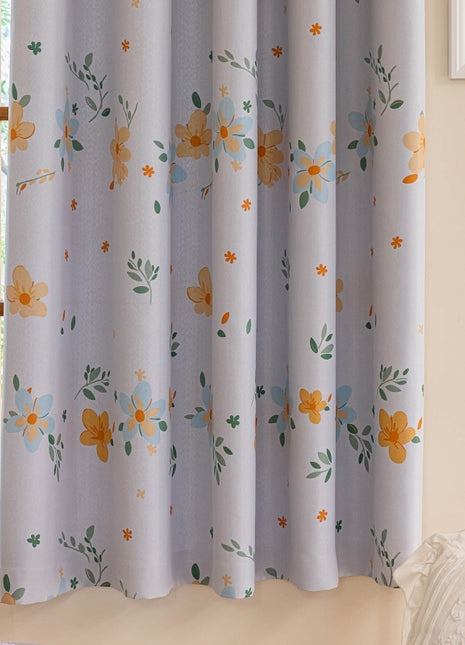 a bed sitting under a window next to a window