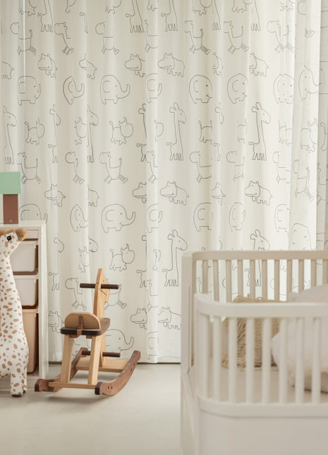 a baby's room with a rocking horse and crib