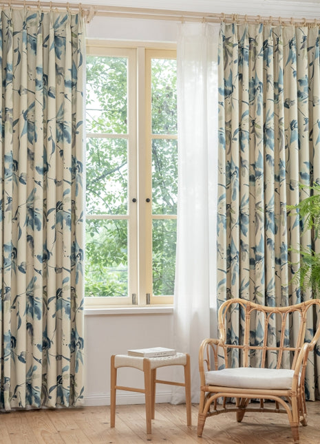 a living room with a chair and a window