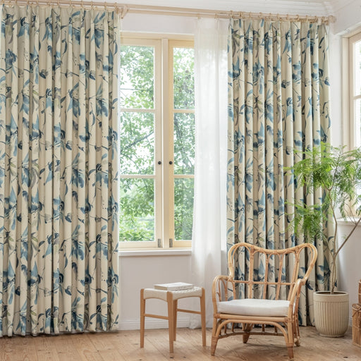 a living room with a chair and a window